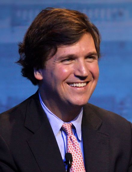 Tucker_Carlson_2013_cropped_noise_rem_lighting_color_correction