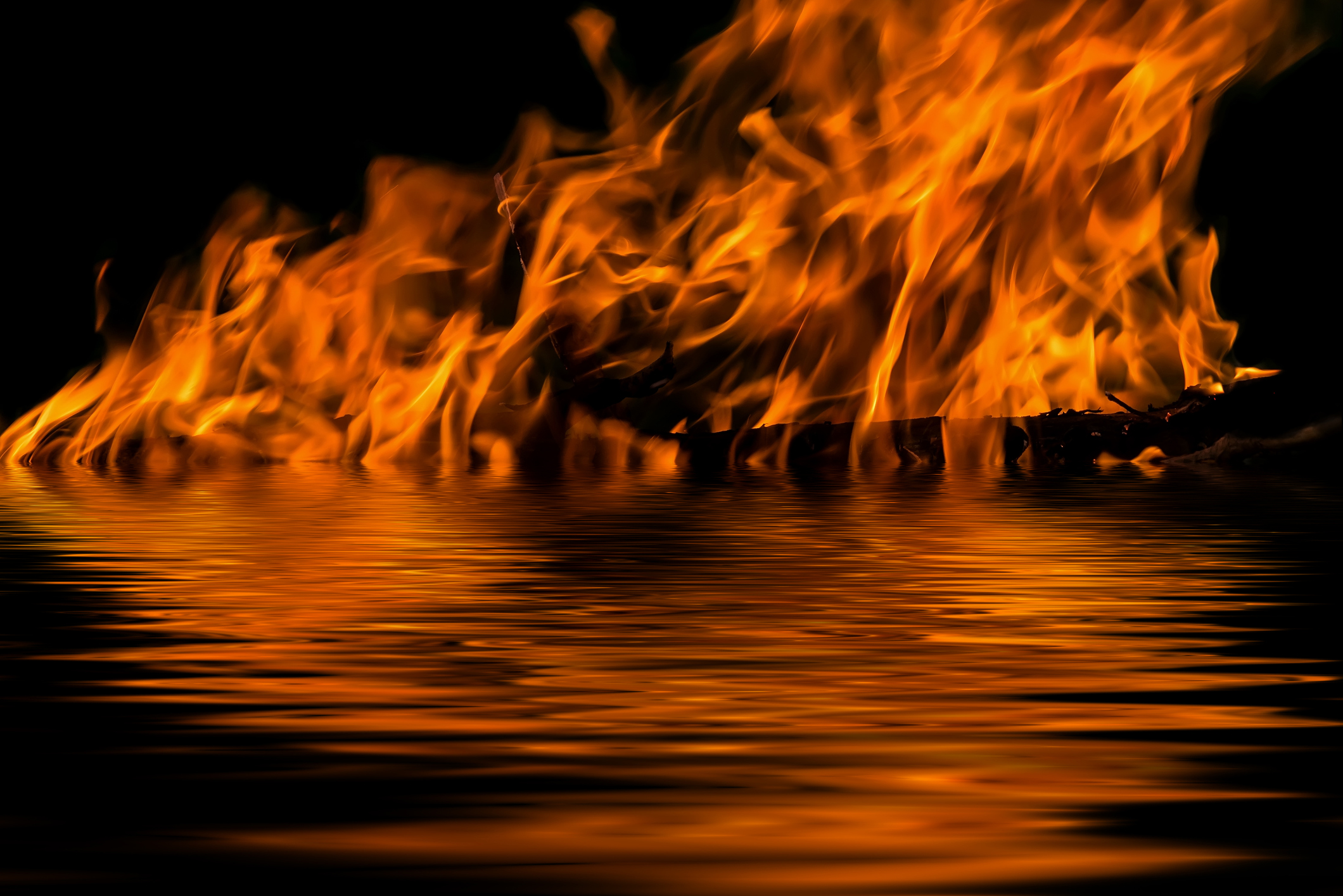 flame fire water reflection
