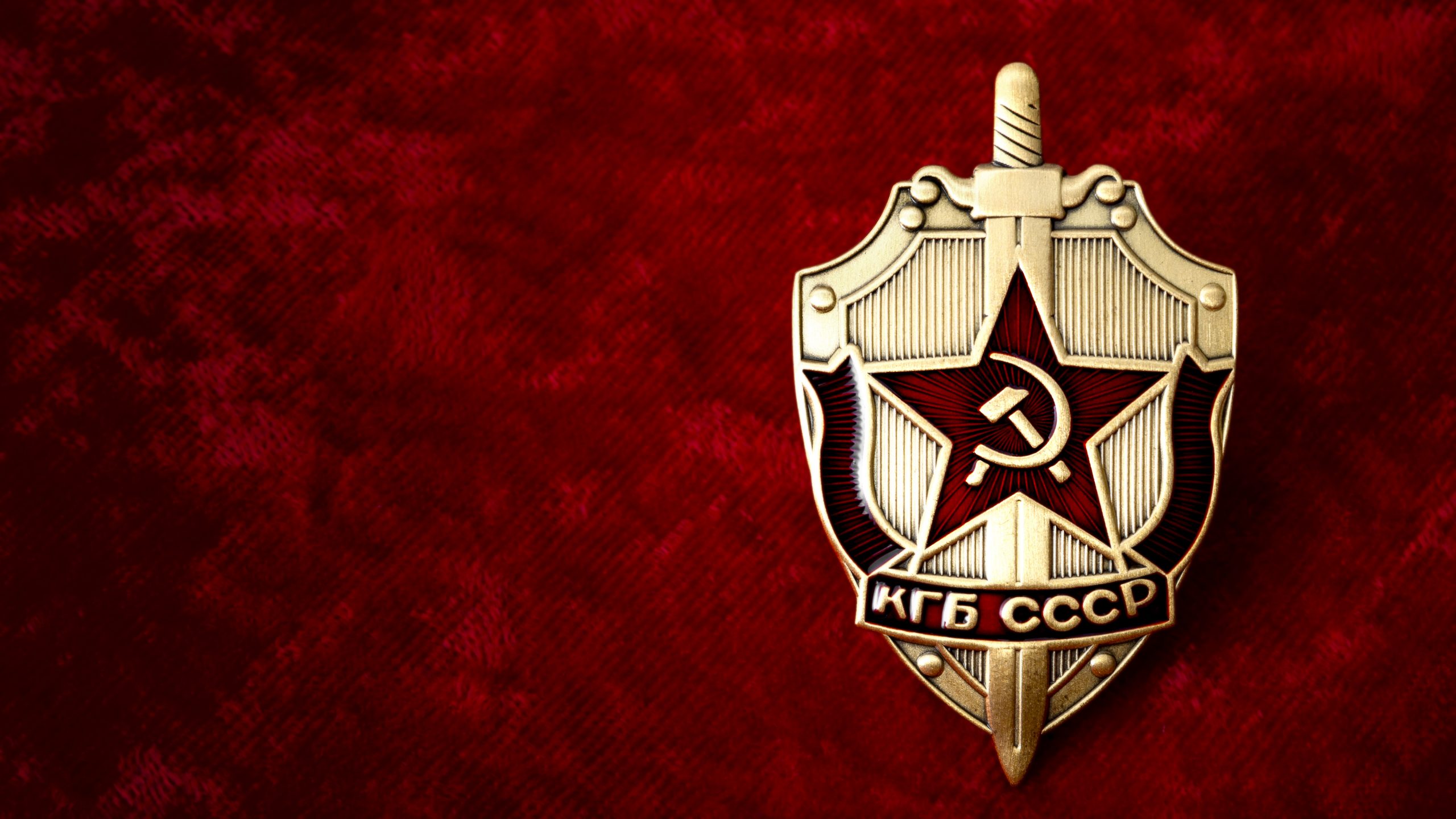 KGB badge on red background with copyspace