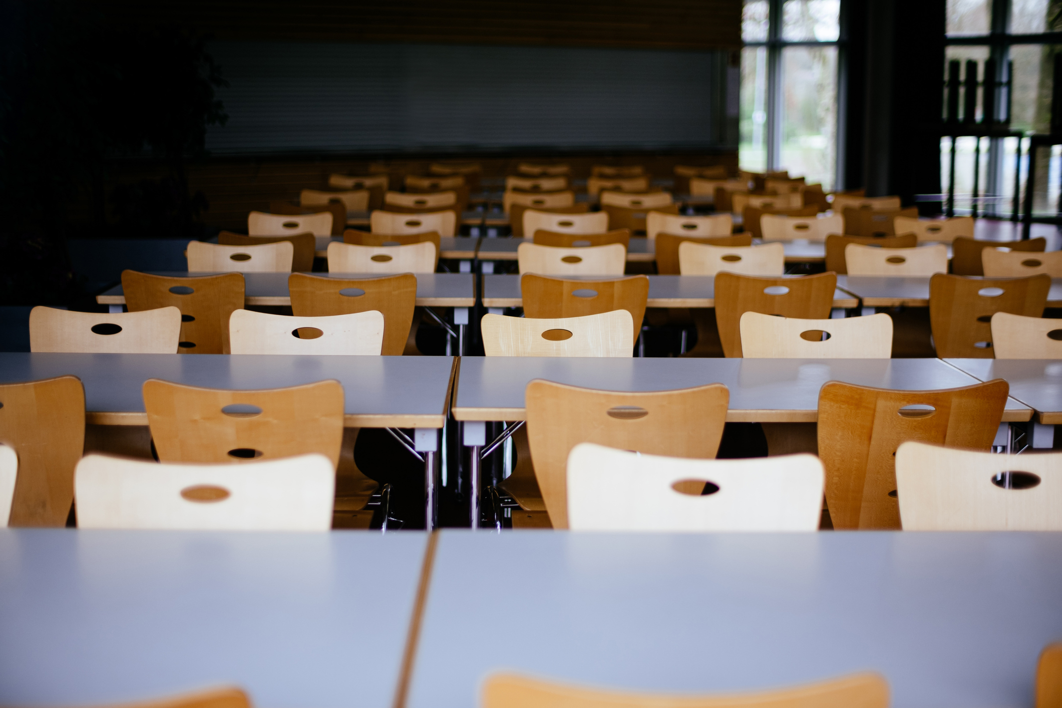 Empty Chairs And Tables In Classroom