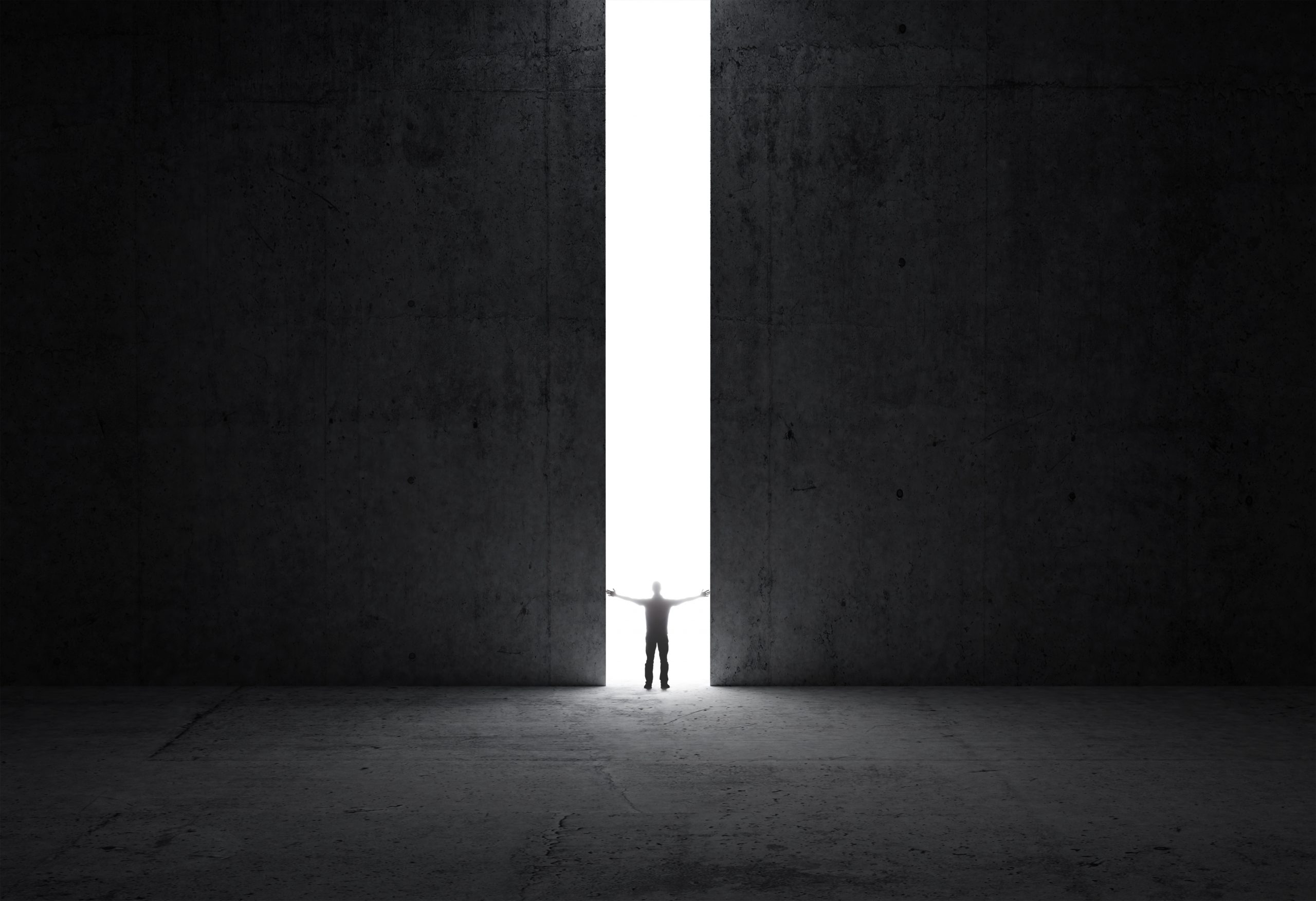 Man stands in the light of opening