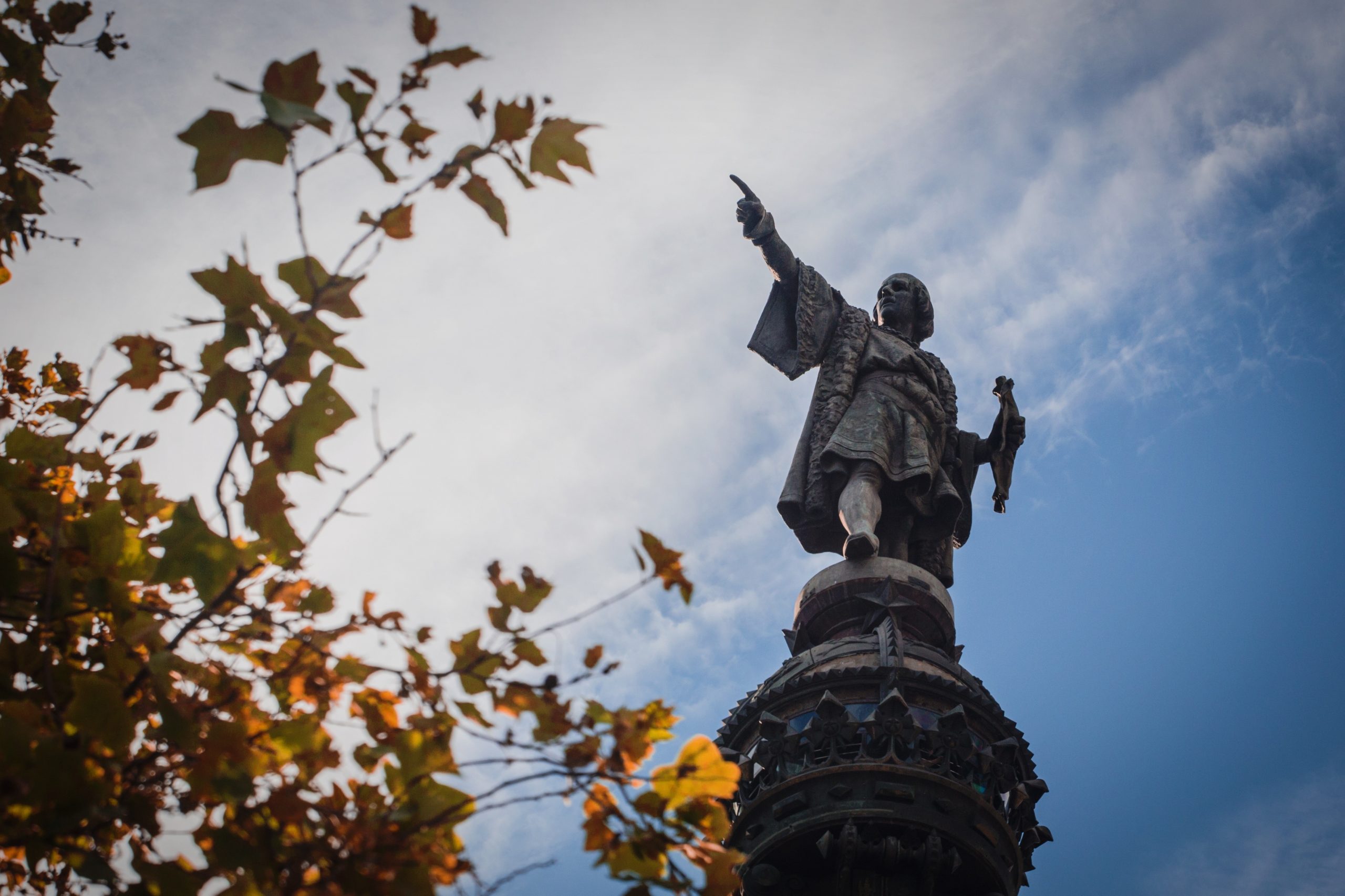 Monument Of Christopher Columbus Against Cloudy Sky