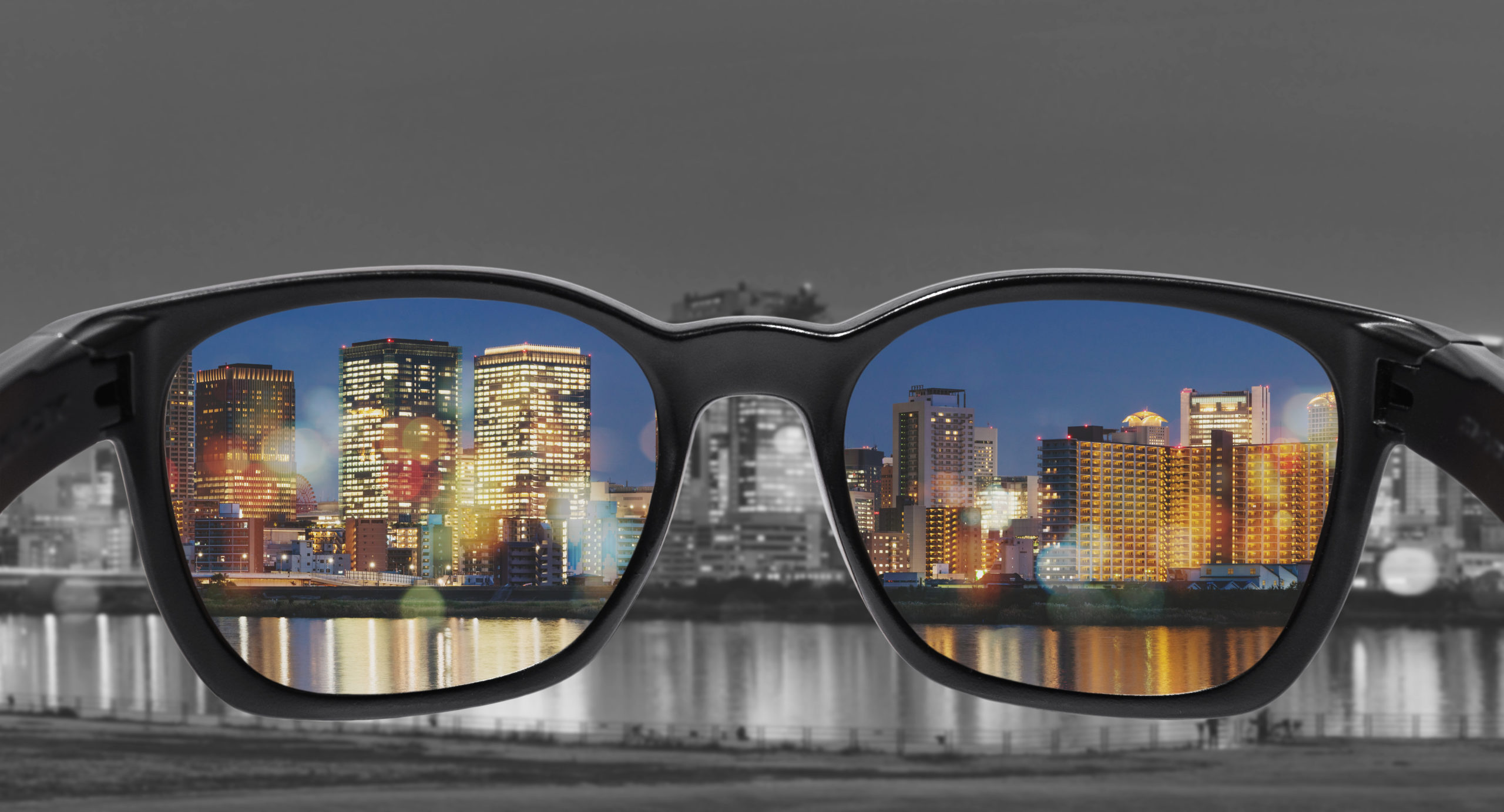 Glasses with city view, selected focus on lens, Color blindness glasses, Smart glass technology