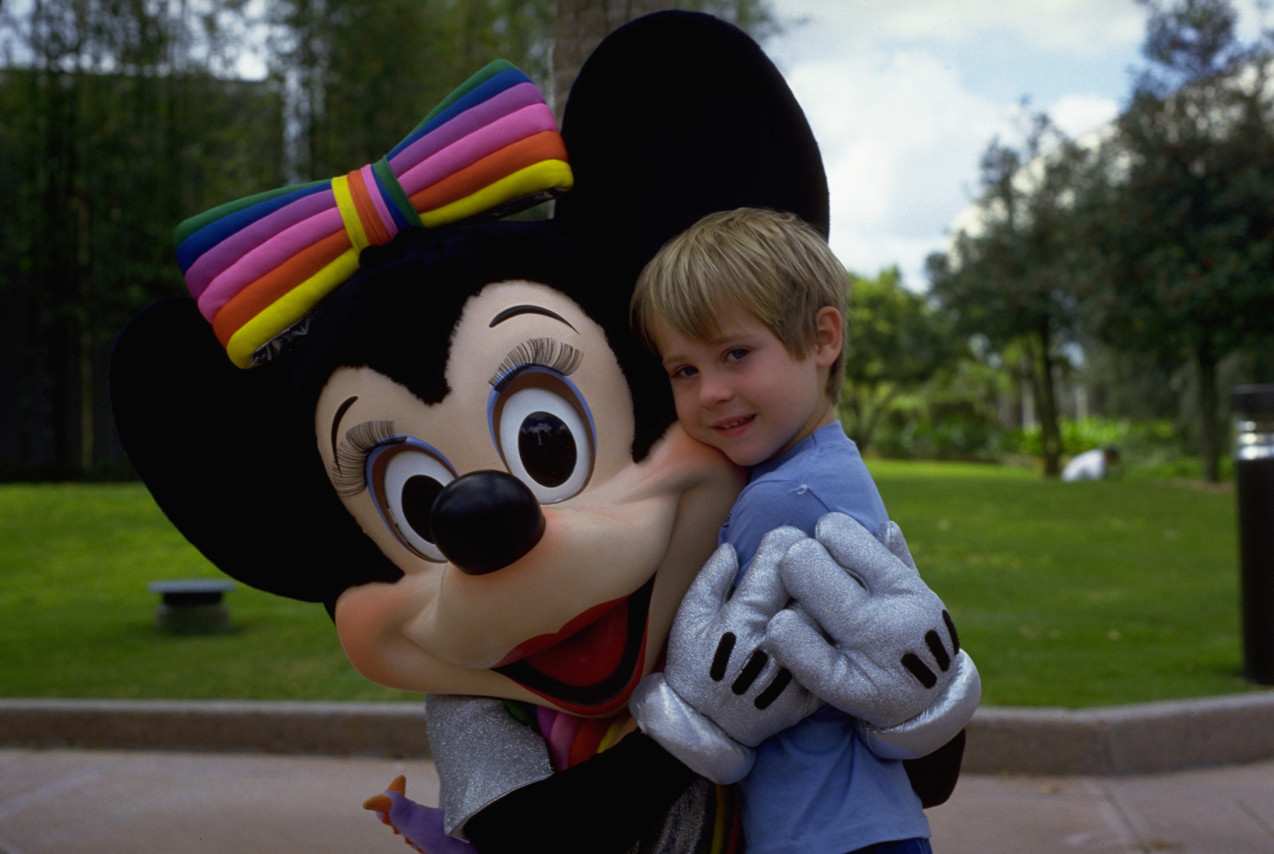 Minnie Mouse Hugging Boy at Disney World