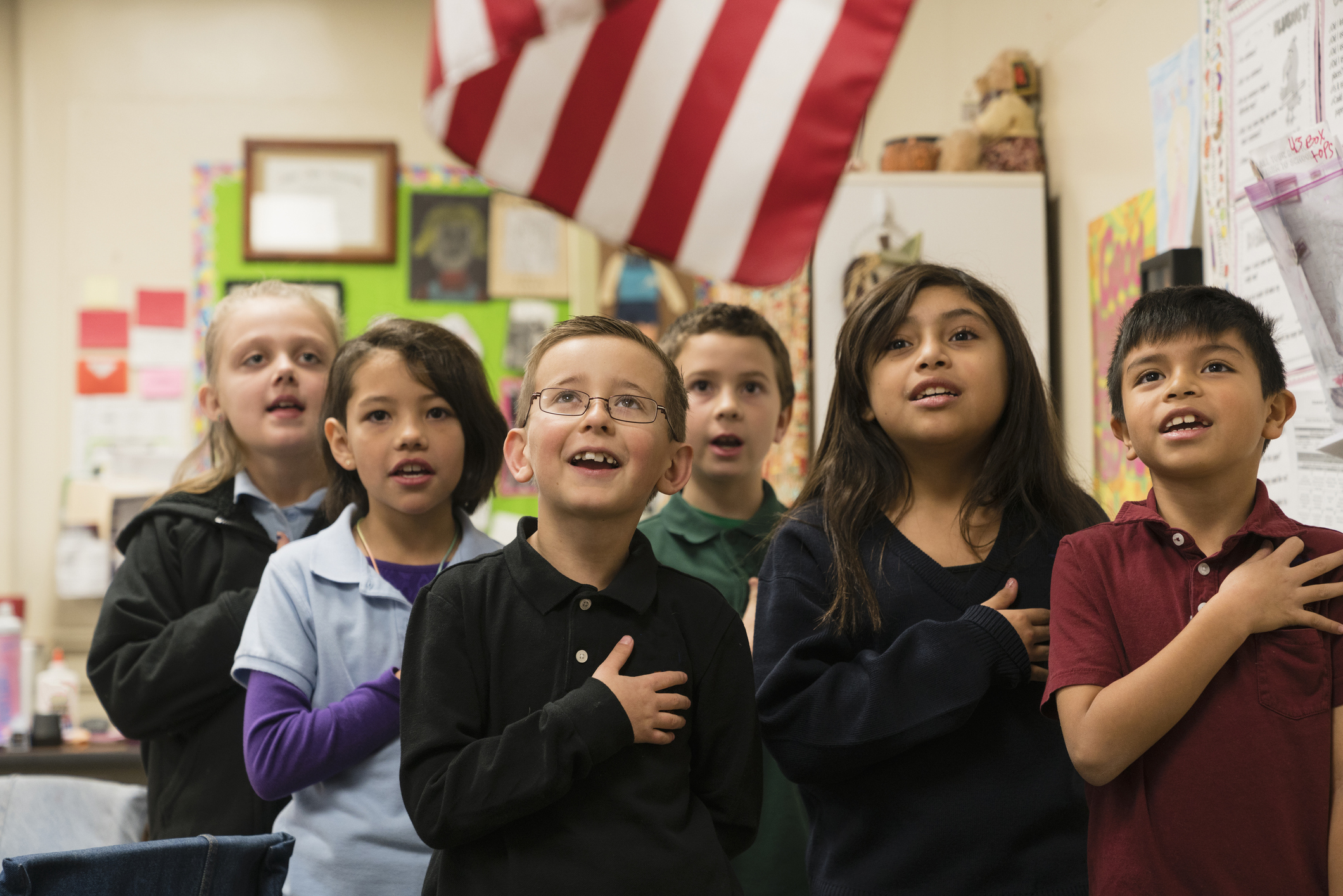 Students standing for Pledge of Allegiance