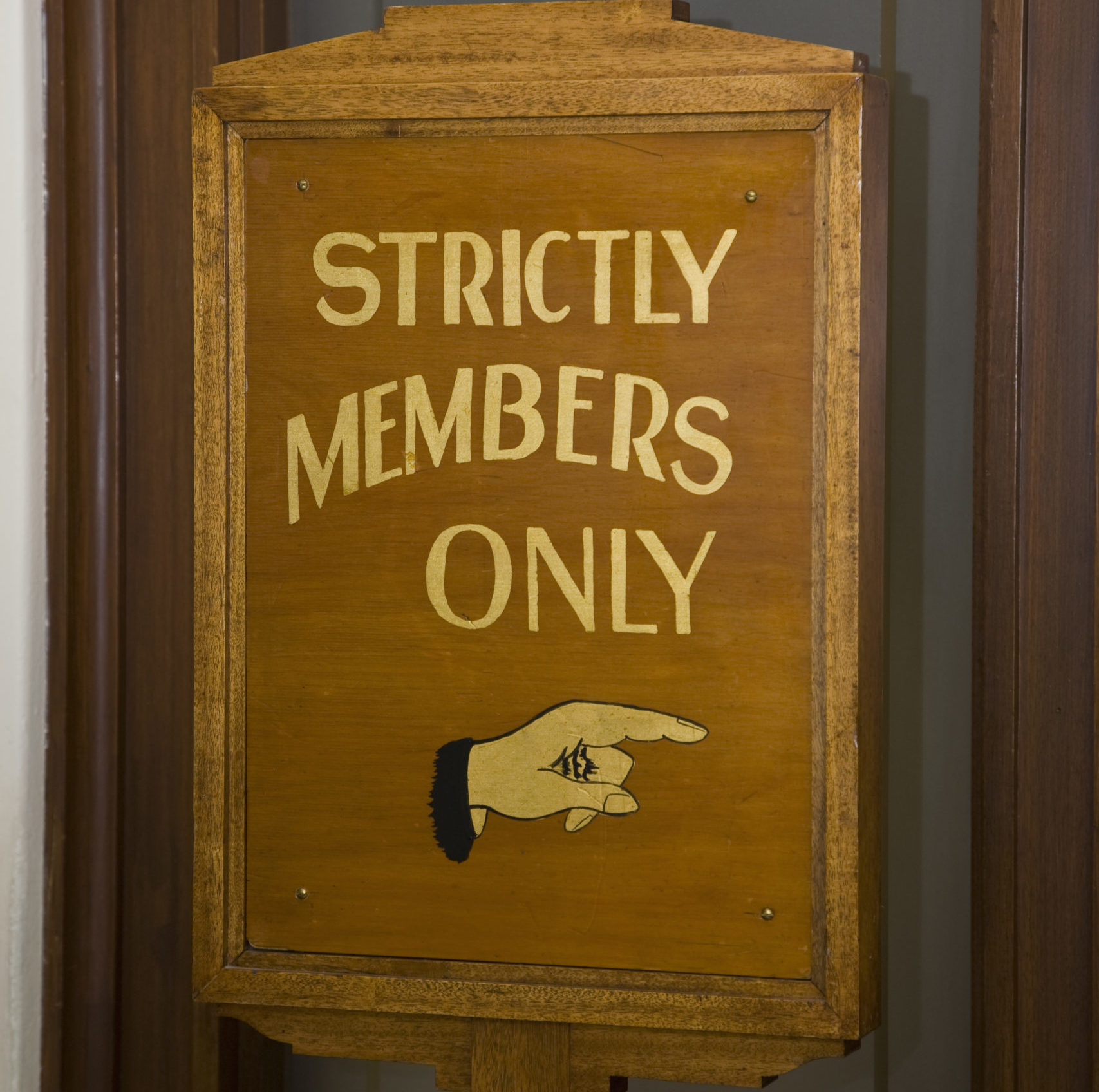 Wooden sign stating STRICTLY MEMBERS ONLY