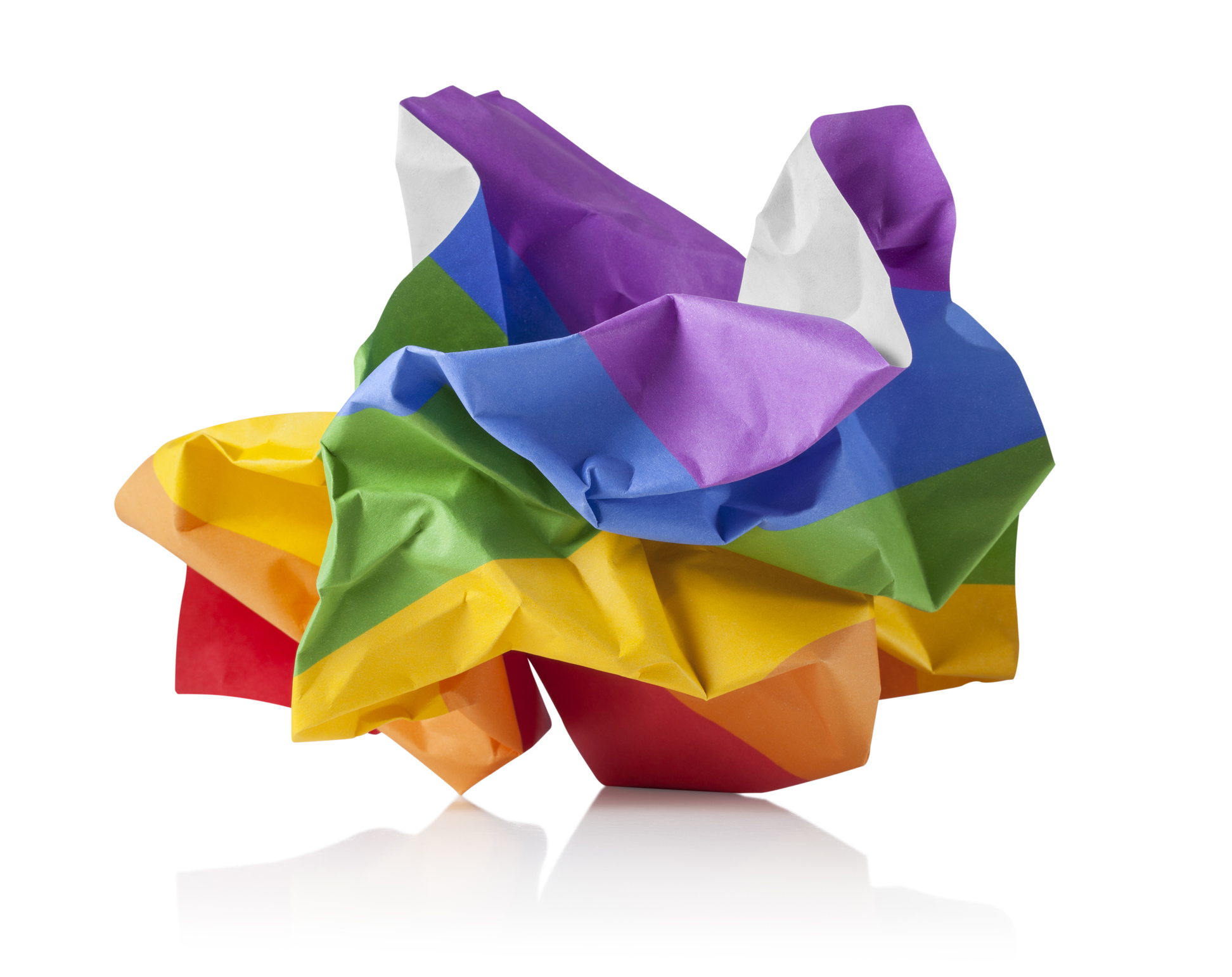 Crumpled paper ball with the colors of the rainbow on white background