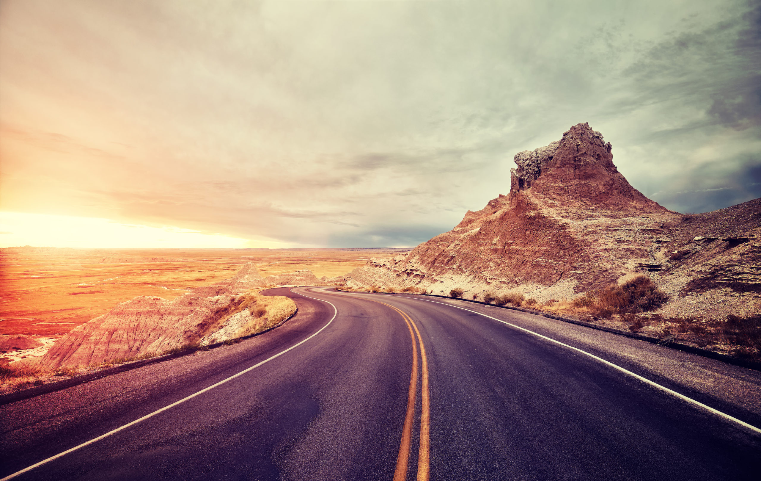 Scenic desert road at sunset, USA.
