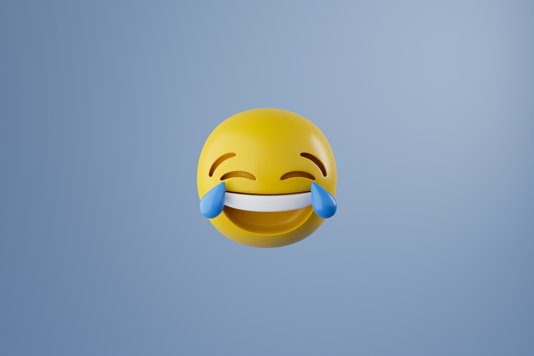Laughing face emoticon with big blue tears at eyes