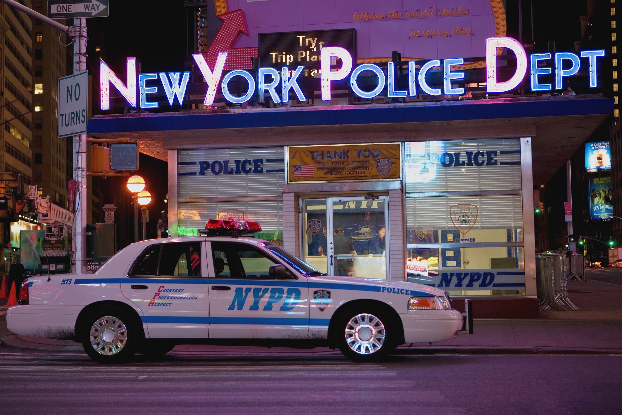 Car in front of a police station, New York City, New York State, USA