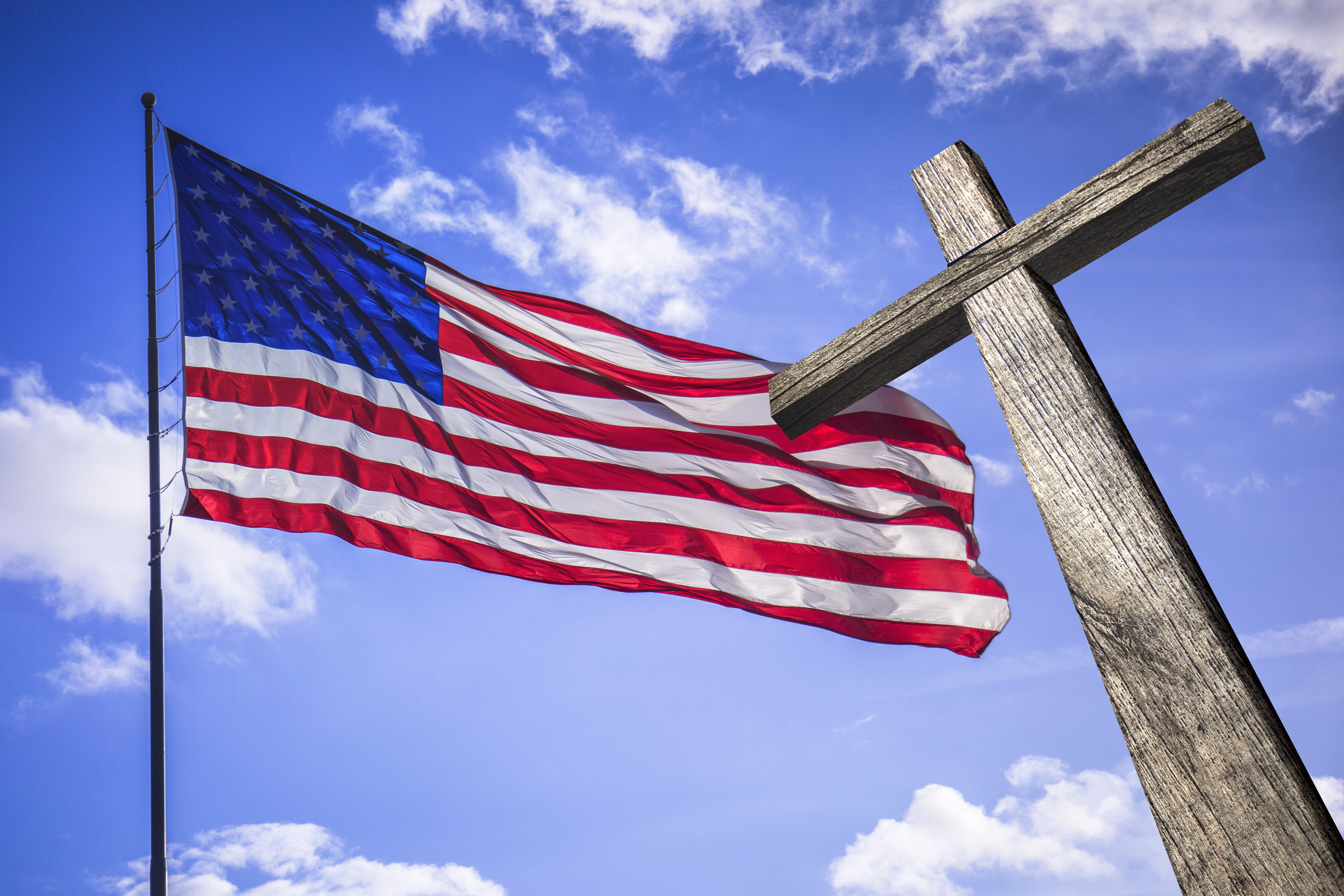 American flag with a wooden cross