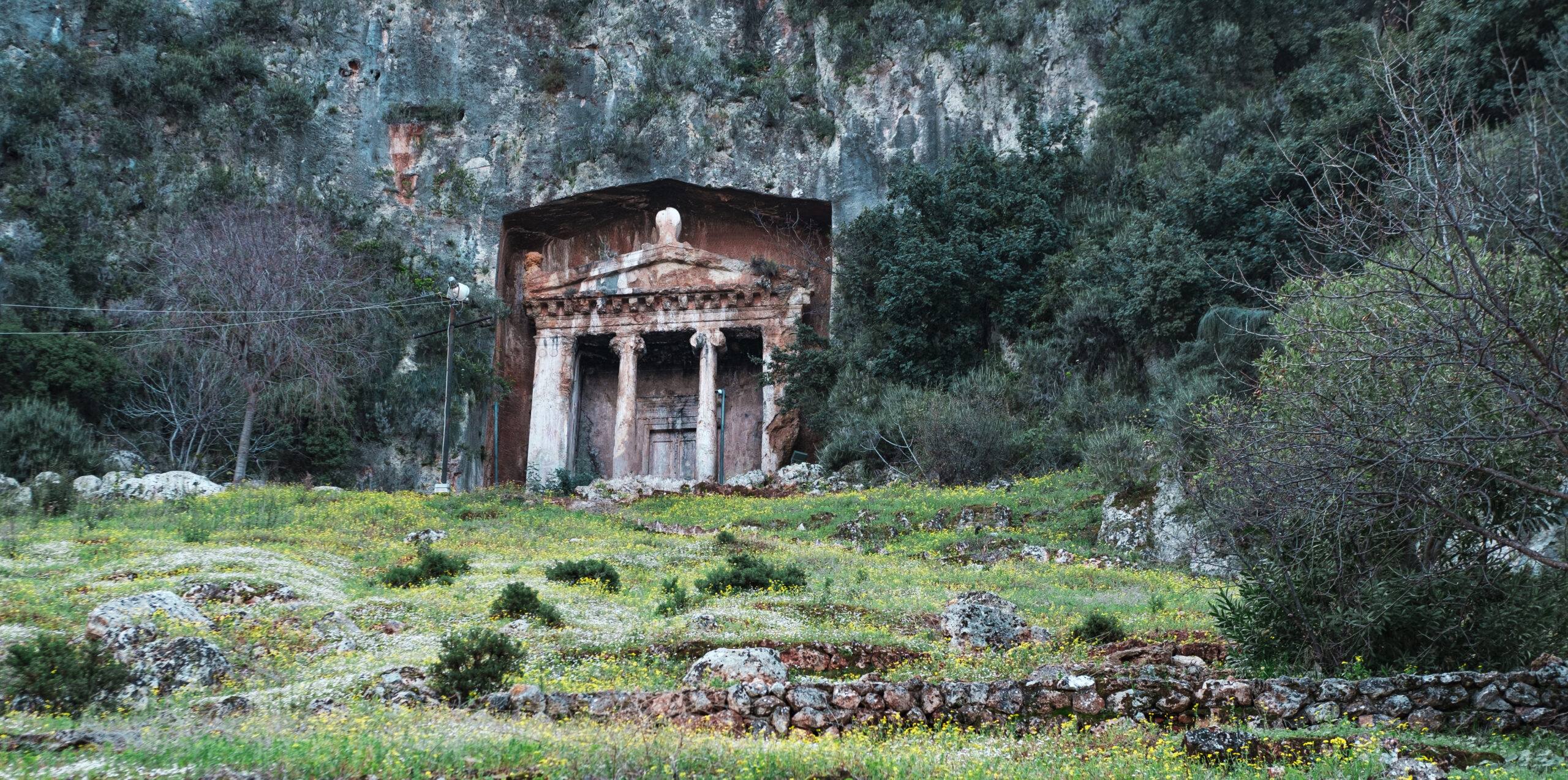 Ancient Lycian tombs,  Carved into the side of the cliff, the Tomb of Amyntas, historical graves in Fethiye