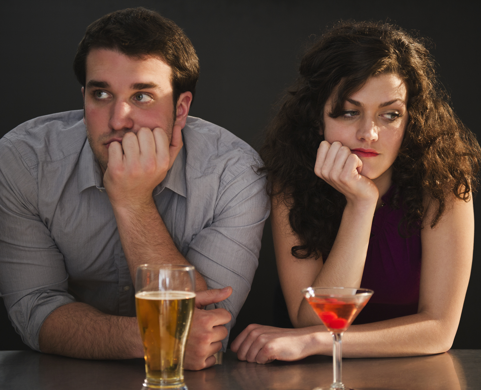 USA, New Jersey, Jersey City, Bored couple sitting at bar counter