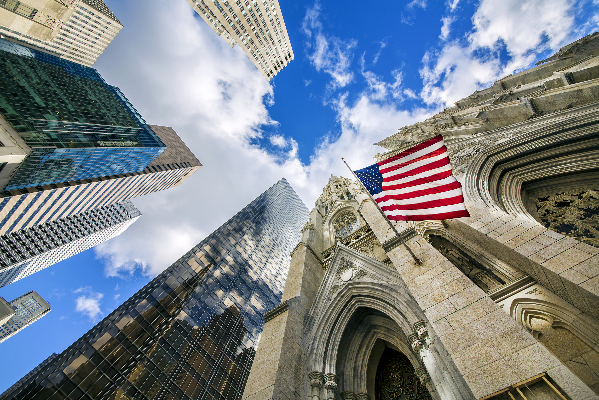 Flag of the United States on St Patrick’s Cathedral among Midtown Skyscrapers, Manhattan, New York