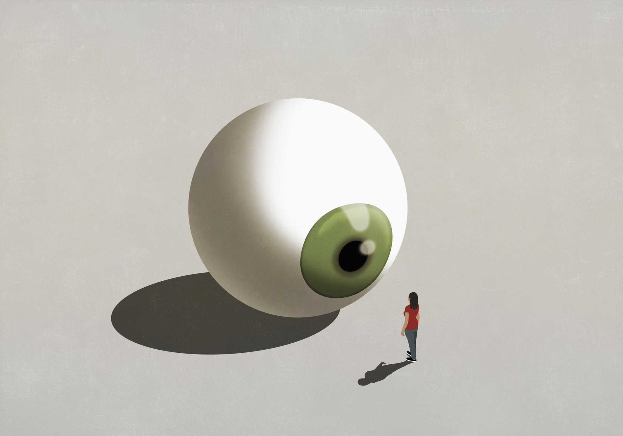 Woman standing at large green eyeball