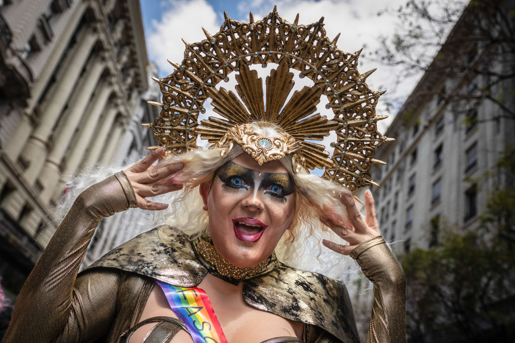 A participate poses for a photo during the LGBTQ parade in