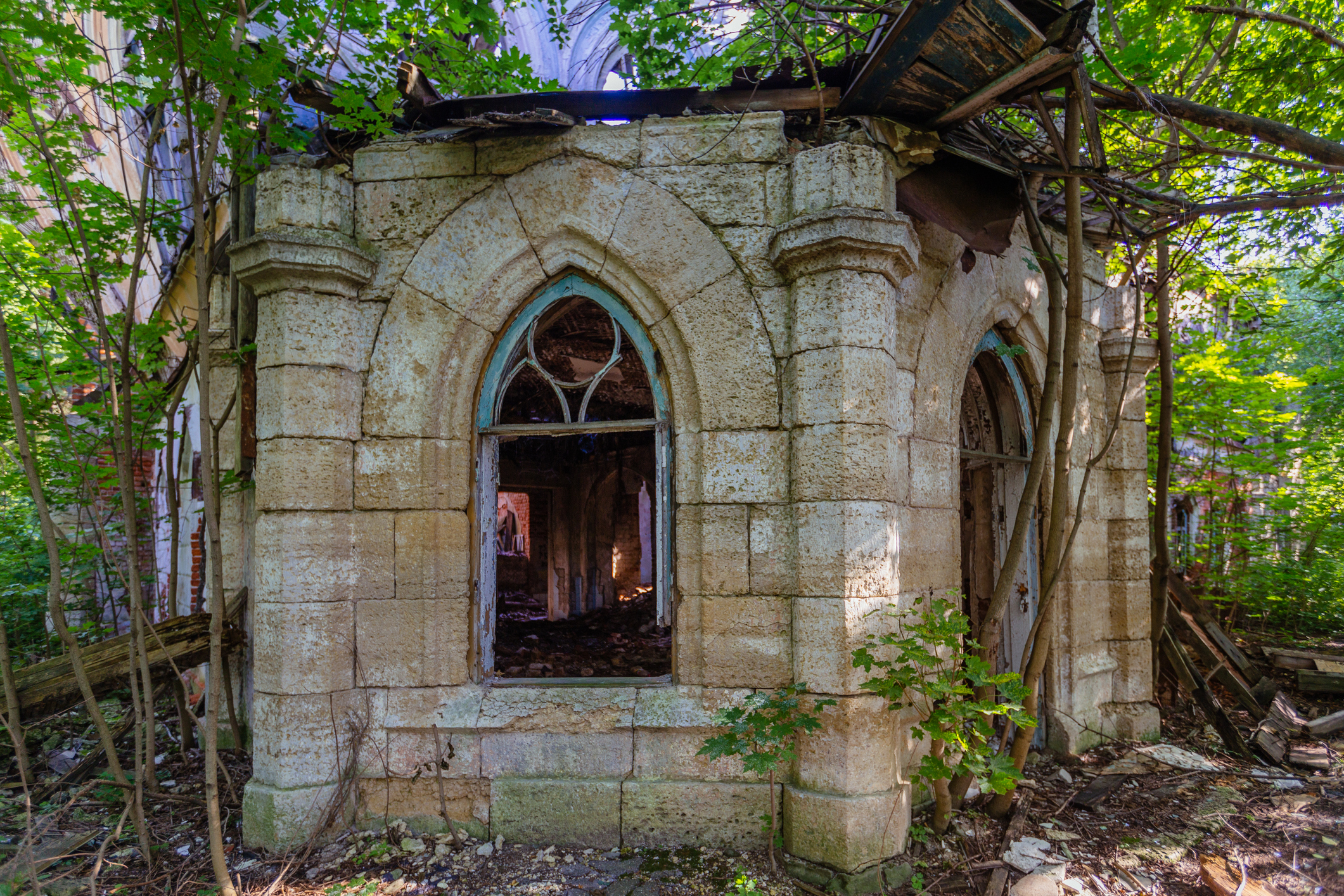 Inside old ruined abandoned historical mansion in Gothic style