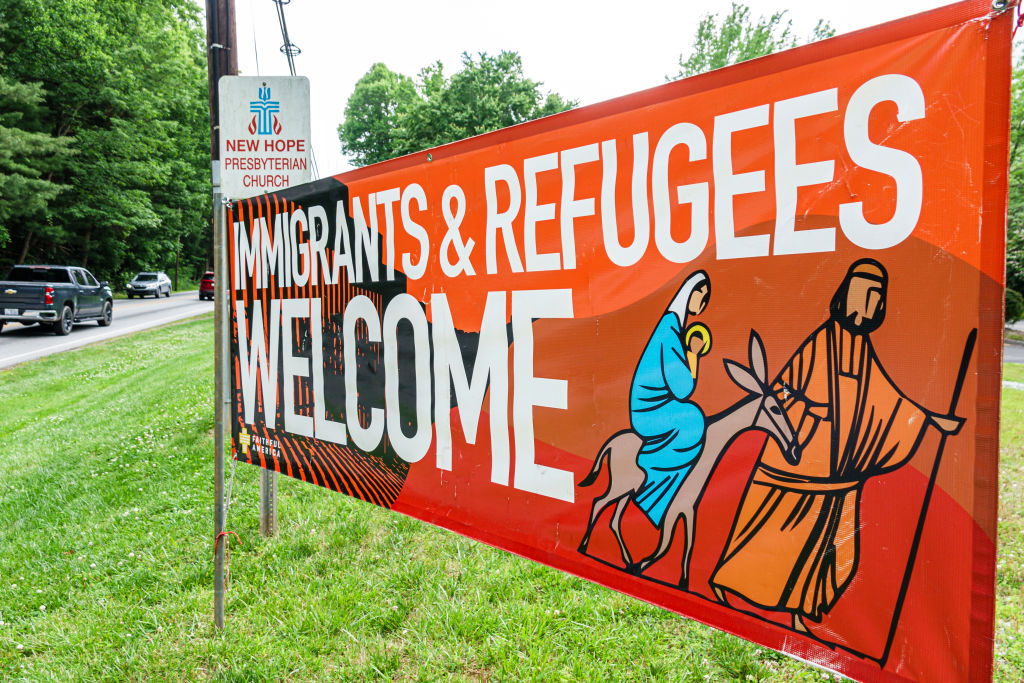 Large roadside banner, immigrants & refugees welcome, Presbyterian church, Asheville, North Carolina