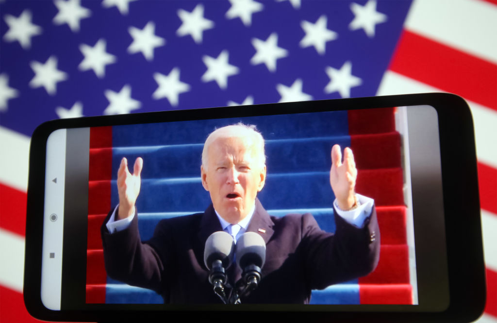 In this photo illustration Joe Biden speaks during his