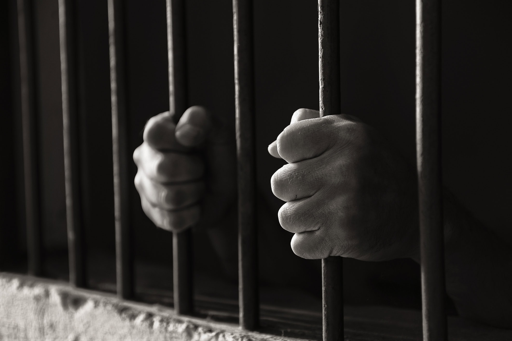 Hands holding the bars