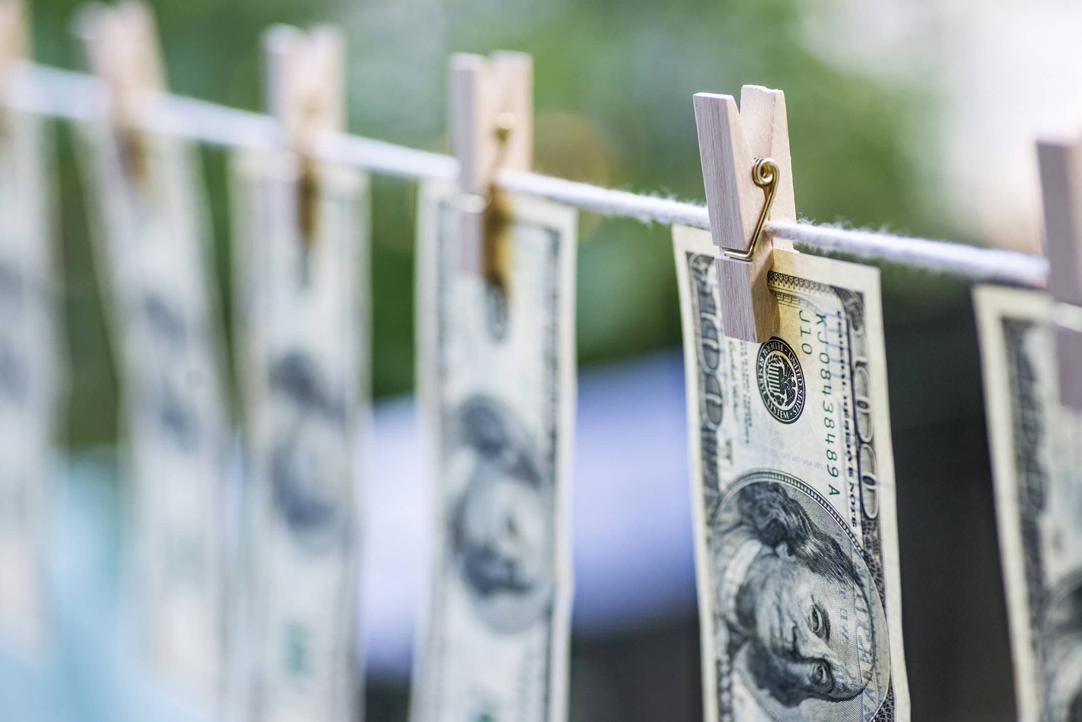 Money Laundering. Money Laundering US dollars hung out to dry. 100 dollar bills hanging on clotheslines